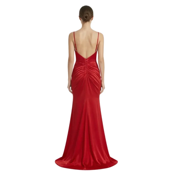 Detailed back view of the Lucienne Ruched Jersey Mermaid Gown highlighting the low back design with spaghetti straps, ruched gathering at the waist, and a sleek back zipper closure leading to the sweeping train.