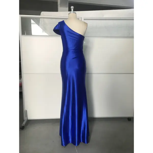 Back view of the Royal Blue stretch satin mermaid gown showcasing the sleek fitted silhouette, clean lines, hidden zipper closure, and graceful floor-length hem.