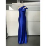 Stunning Royal Blue stretch satin one-shoulder mermaid gown featuring elegant draped neckline and ruched bodice that sculpts the figure in luxurious shine.