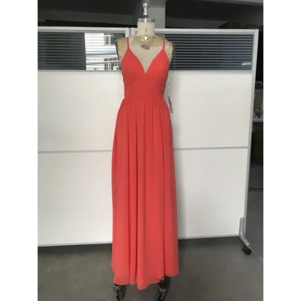 Elegant woman wearing a flowing Burnt Orange chiffon maxi dress with deep V-neckline and subtle high slit, showcasing lightweight fabric with graceful movement and sophisticated old money appeal.