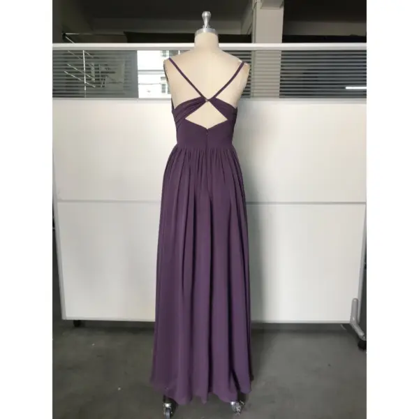 Back view of the Amelie Mauve Chiffon Slit Dress showcasing the criss-cross strap design, cutout detail, hidden back zipper closure, and the full pleated skirt with a flowing high slit that adds movement and sophistication.