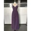 Elegant mauve chiffon dress with a deep V-neckline, delicate spaghetti straps, and intricate pleated bodice and skirt that cascades gracefully to the floor, highlighting its luxurious flow and subtle high slit detail.