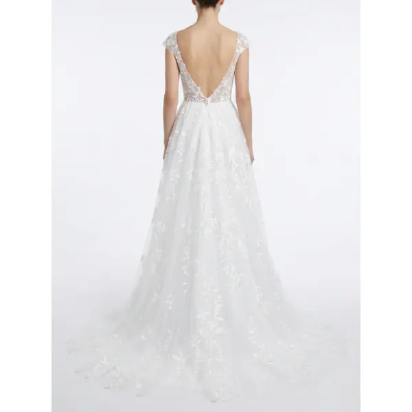 Elegant back view of the Ramona Ivory bridal gown showcasing a dramatic V-back with delicate lace detailing, corset closure and cascading embroidered tulle layers that flow into a chapel train for timeless bridal majesty.