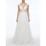 Stunning Ivory Ramona bridal ball gown crafted from delicate embroidered tulle featuring a plunging sweetheart neckline with intricate lace appliqués, cap sleeves and a flowing layered skirt that creates ethereal bridal romance.
