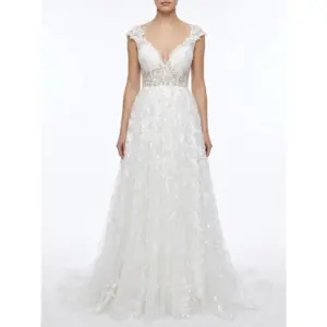 Stunning Ivory Ramona bridal ball gown crafted from delicate embroidered tulle featuring a plunging sweetheart neckline with intricate lace appliqués, cap sleeves and a flowing layered skirt that creates ethereal bridal romance.