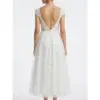 Elegant back view of the Sarah Ivory tulle bridal dress showcasing a deep V-back with intricate floral embroidery and cascading layered tulle skirt perfect for wedding ceremonies