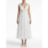 Sarah in stunning Ivory embroidered tulle tea length bridal gown with delicate floral lace appliques, romantic V-neckline and flowing A-line silhouette that captures ethereal romance and bridal glow