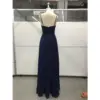 Back view of Evelina Navy Chiffon Gown featuring a sleek ruched bodice, delicate spaghetti straps, concealed zipper closure, and graceful floor-length A-line skirt in luxurious flowing fabric.