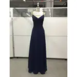Elegant Evelina in rich Navy Chiffon with a flattering V-neckline, delicate lace appliqué at the bodice and waist, and soft ruched detailing that creates a timeless, flowing A-line silhouette.