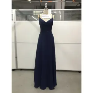 Elegant Evelina in rich Navy Chiffon with a flattering V-neckline, delicate lace appliqué at the bodice and waist, and soft ruched detailing that creates a timeless, flowing A-line silhouette.