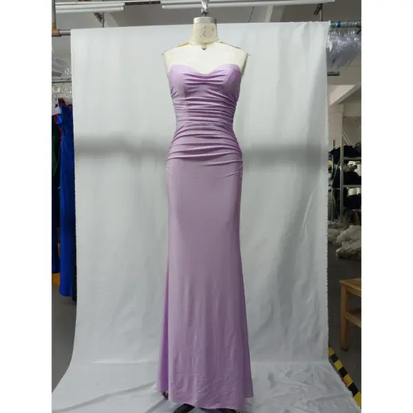 Front view of the Angie Lilac Ruched Jersey Sheath Gown featuring a strapless sweetheart neckline, intricate ruching throughout the bodice and hips, and a sleek column silhouette in luxurious lilac stretch jersey fabric.