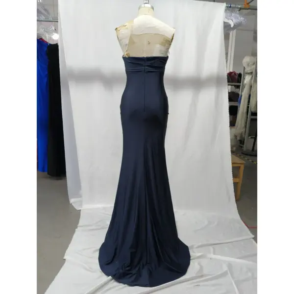 Back view of the Danielle Navy Jersey Strapless Mermaid Gown showcasing a clean fitted silhouette with central zipper closure, smooth jersey drape extending into a graceful sweep train.