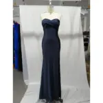 Front view of the Danielle Navy Jersey Strapless Mermaid Gown featuring a sleek strapless sweetheart neckline, fluid jersey fabric that hugs the figure, and a subtle high slit for elegant movement.