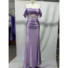 Front view of the Natasha Lilac Stretch Satin Mermaid Gown featuring an off-the-shoulder draped bodice with short flutter sleeves, a sheer corset midsection with vertical beaded straps, ruched natural waist, and a curve-hugging floor-length skirt with a high slit, all in luxurious stretch satin.