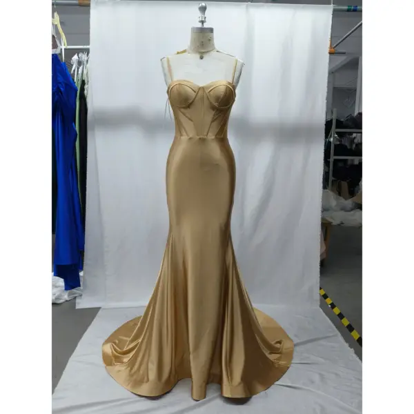Front view of the Flavia Golden Stretch Satin Mermaid Gown featuring a sweetheart neckline with spaghetti straps, sculpted corset bodice with internal boning, and a figure-hugging mermaid silhouette in luxurious golden stretch satin that flows into a dramatic sweeping train.