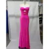 Stunning fuchsia jersey mermaid gown with sweetheart neckline, strategic cut-outs at the bodice, and a flattering high slit that showcases the figure-hugging stretch fabric of the Antonina dress.