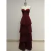 Stunning Elizabeth Burgundy tiered chiffon ball gown featuring a sweetheart neckline, intricate lace appliques with rhinestones on the bodice, and cascading layered chiffon skirt in rich burgundy hue.