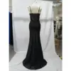 Back view of the Anita Black Jersey Slit Sheath Gown showcasing an illusion sheer corset panel with vertical boning details, delicate spaghetti straps, and a sweeping train in luxurious black jersey fabric.