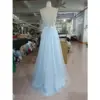 Back view of the Emily Baby Blue Tulle Ball Gown showcasing a stunning criss-cross lace-up corset back with intricate beaded and embroidered appliques, creating an elegant and romantic silhouette in shimmering glitter tulle.
