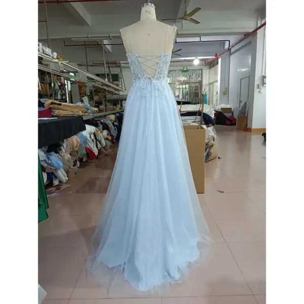 Back view of the Emily Baby Blue Tulle Ball Gown showcasing a stunning criss-cross lace-up corset back with intricate beaded and embroidered appliques, creating an elegant and romantic silhouette in shimmering glitter tulle.