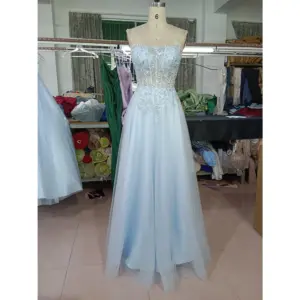 Front view of the Emily Baby Blue Tulle Ball Gown featuring a sweetheart neckline with delicate spaghetti straps, intricate silver sequin and embroidered lace appliques on the bodice and waist, and a full sparkling glitter tulle skirt.