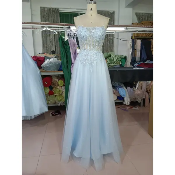 Front view of the Emily Baby Blue Tulle Ball Gown featuring a sweetheart neckline with delicate spaghetti straps, intricate silver sequin and embroidered lace appliques on the bodice and waist, and a full sparkling glitter tulle skirt.