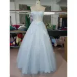 Stunning Baby Blue tulle ball gown on mannequin featuring a sparkling sweetheart neckline with intricate 3D floral lace appliques, embroidered details, and sequined sparkle throughout the full skirt.