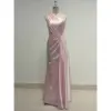 Elegant Liora in Baby Pink Polyester Satin featuring a one-shoulder neckline with soft draping and ruched detailing that sculpts the figure in a sleek floor-length sheath silhouette.