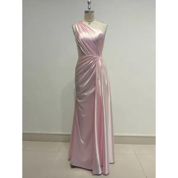 Elegant Liora in Baby Pink Polyester Satin featuring a one-shoulder neckline with soft draping and ruched detailing that sculpts the figure in a sleek floor-length sheath silhouette.