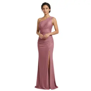 Elegant woman wearing a rich grape-colored one-shoulder jersey gown with draped asymmetrical neckline, ruched bodice and waist, and a high slit revealing the leg. The luxurious stretch jersey fabric creates a figure-flattering mermaid silhouette perfect for formal occasions.