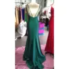 Detailed back view of Elena in Teal Jersey Mermaid Dress highlighting the strappy open back design with multiple criss-cross spaghetti straps and concealed back zipper closure along the fitted mermaid silhouette