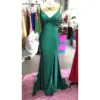 Front view of Elena Teal Jersey Mermaid Dress featuring a plunging V-neckline with intricate ruched twist detail at the bust, figure-hugging silhouette, and dramatic front slit in luxurious teal fabric