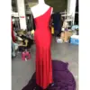 Detailed back view of Giselle Jersey One-Shoulder Dress highlighting the sleek closed back design, concealed zipper closure, and smooth draping of the premium red jersey fabric that follows the body's natural curves.