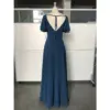 Back view of Clémence Dark Navy Chiffon Dress showcasing an open V-back with delicate tie detail, graceful flutter sleeves, and smooth flowing chiffon fabric.