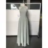Front view of the Simone Sage Green Chiffon Halter A-Line Gown featuring a pleated halter neckline, ruched bodice at the waist, and flowing floor-length A-line skirt in luxurious sage green chiffon fabric.