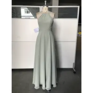Front view of the Simone Sage Green Chiffon Halter A-Line Gown featuring a pleated halter neckline, ruched bodice at the waist, and flowing floor-length A-line skirt in luxurious sage green chiffon fabric.