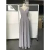 Front view of the Jolanda Silver Chiffon dress featuring a flattering ruched V-neckline, sleeveless design, and flowing A-line skirt in luxurious silver chiffon fabric that creates an elegant, ethereal silhouette.