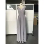 Front view of the Jolanda Silver Chiffon dress featuring a flattering ruched V-neckline, sleeveless design, and flowing A-line skirt in luxurious silver chiffon fabric that creates an elegant, ethereal silhouette.