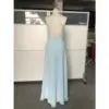 Back view of the Megan Sky Blue Chiffon Slit Dress showcasing an open back with criss-cross halter straps, a concealed zipper, and the soft drape of premium chiffon fabric.