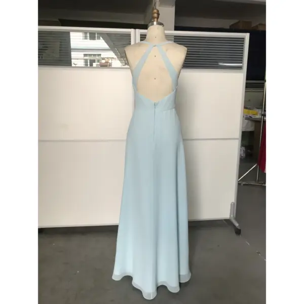 Back view of the Megan Sky Blue Chiffon Slit Dress showcasing an open back with criss-cross halter straps, a concealed zipper, and the soft drape of premium chiffon fabric.