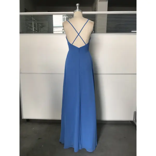 Back view of Ocean Blue chiffon gown showing criss-cross strap details, low open back, and back zipper closure with flowing floor-length hem