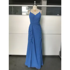 Ocean Blue chiffon gown with V-neckline, delicate spaghetti straps, ruched waist detailing, side ruffles, and high slit on a mannequin