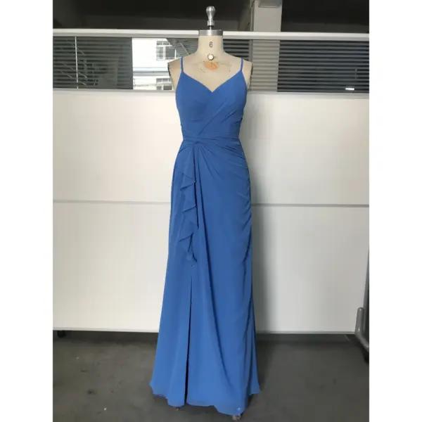 Ocean Blue chiffon gown with V-neckline, delicate spaghetti straps, ruched waist detailing, side ruffles, and high slit on a mannequin