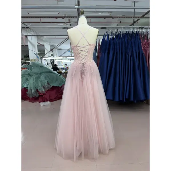 Detailed back view of Juliette Tulle Embroidered A-Line Gown highlighting the criss-cross strap design, lace-up corset back with delicate pink ribbon ties and embroidered lace applique details along the sheer tulle bodice