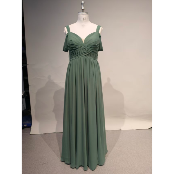 Front view of the Angela Eucalyptus chiffon gown featuring a romantic sweetheart neckline with ruched and pleated bodice, cold shoulder short flutter sleeves, and a flowing A-line skirt with a graceful high slit. The soft eucalyptus green chiffon drapes beautifully for weddings and formal occasions.