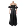 Front view of the Alix Black Stretch Satin Embroidered A-Line Gown featuring a sweetheart off-the-shoulder neckline with dramatic puff sleeves, intricate black beaded and embroidered appliqué bodice, and fluid stretch satin skirt with subtle center slit.