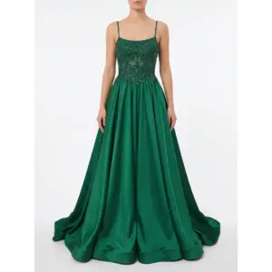 Stunning model wearing the Barbara Hunter Green stretch satin ball gown featuring a square neckline with delicate spaghetti straps, heavily beaded and embroidered sheer bodice with intricate lace appliqué, and a voluminous flowing A-line skirt that cascades dramatically to the floor.