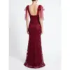 Back view of the Joanna Burgundy Embroidered Tulle Mermaid Gown showcasing an open low back with delicate straps, intricate embroidered lace appliqués with sparkling beading and sequins cascading down the figure-hugging silhouette, and matching detachable burgundy tulle sleeves on a model.
