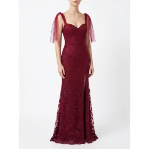 Front view of the Joanna Burgundy Embroidered Tulle Mermaid Gown featuring a sweetheart neckline, intricate floral lace appliqués with delicate beading and sequins throughout the fitted bodice and hips, a thigh-high slit, and dramatic detachable burgundy tulle flutter sleeves on a model.