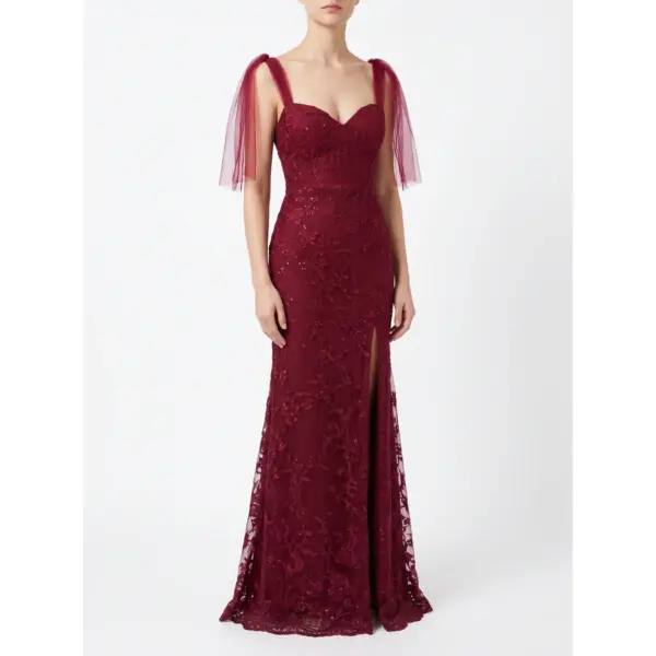 Front view of the Joanna Burgundy Embroidered Tulle Mermaid Gown featuring a sweetheart neckline, intricate floral lace appliqués with delicate beading and sequins throughout the fitted bodice and hips, a thigh-high slit, and dramatic detachable burgundy tulle flutter sleeves on a model.